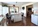 Well-lit kitchen boasts a granite island and modern appliances, creating a stylish and functional space at 300 Kathryn Ct, Clayton, IN 46118