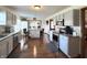 Well-lit kitchen with stainless steel appliances, grey cabinets, granite countertops, and a central island with seating at 300 Kathryn Ct, Clayton, IN 46118