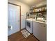 Well-equipped laundry room with modern appliances and storage shelves simplifies household tasks at 300 Kathryn Ct, Clayton, IN 46118