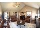 Spacious living room with vaulted ceiling, ample seating, and large windows for a bright and inviting atmosphere at 300 Kathryn Ct, Clayton, IN 46118