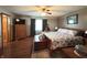 Inviting main bedroom has a king bed, fan, and warm lighting, creating a relaxing and peaceful retreat at 300 Kathryn Ct, Clayton, IN 46118