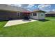 Spacious patio with a dining set and red umbrella is perfect for outdoor entertaining at 300 Kathryn Ct, Clayton, IN 46118