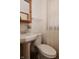 Bathroom featuring a pedestal sink, toilet, and tiled floors at 3438 Olive St, Indianapolis, IN 46227