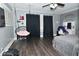 Gray toned bedroom with hanging chair and modern fixtures at 3438 Olive St, Indianapolis, IN 46227