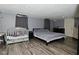 Cozy bedroom featuring hardwood floors and neutral tones, perfect for relaxation and comfort at 3438 Olive St, Indianapolis, IN 46227