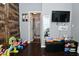 Cozy bedroom with hardwood floors provides access to an adjacent bathroom at 3438 Olive St, Indianapolis, IN 46227
