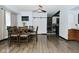 Bright dining area with a ceiling fan seamlessly connecting to the kitchen at 3438 Olive St, Indianapolis, IN 46227