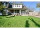 Charming two-story home with a well-maintained front yard and inviting front porch at 3438 Olive St, Indianapolis, IN 46227