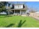 Charming two-story home with a well-maintained front yard and inviting front porch at 3438 Olive St, Indianapolis, IN 46227
