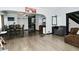 Spacious living room features hardwood floors, seamlessly connecting to the dining area at 3438 Olive St, Indianapolis, IN 46227