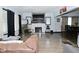 Bright living room with hardwood floors, fireplace, and a view into the dining area at 3438 Olive St, Indianapolis, IN 46227