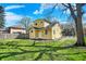 Backyard showcases a lush lawn, wooden fence, and beautiful landscaping for outdoor enjoyment at 3484 Birchwood Ave, Indianapolis, IN 46205