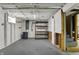 Unfinished basement with concrete walls, shelving, utility access, and ample space for storage at 3484 Birchwood Ave, Indianapolis, IN 46205