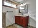 Bathroom featuring vanity with red cabinets and solid surface countertop at 3484 Birchwood Ave, Indianapolis, IN 46205