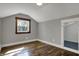 Bright bedroom featuring hardwood floors, a window, and a closet for ample storage at 3484 Birchwood Ave, Indianapolis, IN 46205