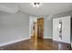Empty bedroom features hardwood floors, closet, and neutral paint at 3484 Birchwood Ave, Indianapolis, IN 46205