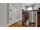 Hallway featuring wood and metal railing and bonus room at 3484 Birchwood Ave, Indianapolis, IN 46205