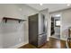 Modern kitchen with stainless steel refrigerator and wood floors at 3484 Birchwood Ave, Indianapolis, IN 46205