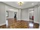 Open-concept living room showing hardwood floors, recessed lighting and multiple doorways at 3484 Birchwood Ave, Indianapolis, IN 46205