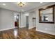 Open-concept room featuring hardwood floors and doorways leading to other rooms at 3484 Birchwood Ave, Indianapolis, IN 46205