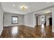 Open floor plan showcasing hardwood floors and recessed lighting, perfect for entertaining guests at 3484 Birchwood Ave, Indianapolis, IN 46205