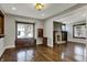 Comfortable living area with hardwood floors and a built-in window seat overlooking the yard at 3484 Birchwood Ave, Indianapolis, IN 46205