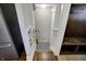 The mudroom features built-in shelves, hooks, bench, white door, and hardwood floors at the entrance at 3484 Birchwood Ave, Indianapolis, IN 46205