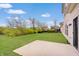 Spacious backyard with a concrete patio and lush green lawn at 3799 Hoosier Down Dr, Bargersville, IN 46106