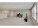 Large carpeted basement area featuring a table and chair set, and an exercise machine at 3799 Hoosier Down Dr, Bargersville, IN 46106