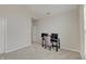 Bright bedroom features neutral walls, plush carpeting, and a dedicated desk area near the window at 3799 Hoosier Down Dr, Bargersville, IN 46106