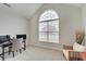 Charming bedroom featuring a desk area with a beautiful arched window and natural light at 3799 Hoosier Down Dr, Bargersville, IN 46106