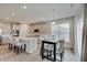 Bright kitchen and dining area with gray cabinets, a center island, and stylish chairs at 3799 Hoosier Down Dr, Bargersville, IN 46106