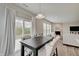 Dining table featuring chairs and pendant lighting, and a view of a cozy living room at 3799 Hoosier Down Dr, Bargersville, IN 46106