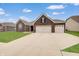 Stunning brick home features a three-car garage and a wide driveway at 3799 Hoosier Down Dr, Bargersville, IN 46106