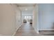 Hallway with doors leading to a bright living room at 3799 Hoosier Down Dr, Bargersville, IN 46106