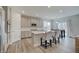 Modern kitchen featuring a center island, gray cabinets, and an open layout into the dining area at 3799 Hoosier Down Dr, Bargersville, IN 46106