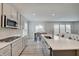 Bright kitchen featuring hardwood floors, stainless steel appliances, and an open layout at 3799 Hoosier Down Dr, Bargersville, IN 46106