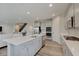Open-concept kitchen with gray cabinets, a large center island, and stainless steel appliances at 3799 Hoosier Down Dr, Bargersville, IN 46106