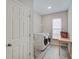 Clean laundry room featuring modern appliances, vinyl flooring, and wire shelving at 3799 Hoosier Down Dr, Bargersville, IN 46106