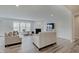 Bright living room with modern gray floors and a cozy fireplace at 3799 Hoosier Down Dr, Bargersville, IN 46106