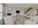 Inviting living area with fireplace and views to the staircase at 3799 Hoosier Down Dr, Bargersville, IN 46106