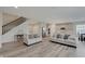 Open concept living space with wood floors and stainless steel appliances at 3799 Hoosier Down Dr, Bargersville, IN 46106