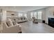 Bright living room featuring hardwood floors, a fireplace, and plenty of natural light at 3799 Hoosier Down Dr, Bargersville, IN 46106