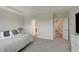 Serene main bedroom includes en suite bath and a second door, soft carpet, and large windows at 3799 Hoosier Down Dr, Bargersville, IN 46106