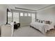 Spacious main bedroom boasts tray ceilings, three windows, a TV, and a cozy chair at 3799 Hoosier Down Dr, Bargersville, IN 46106