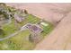 Expansive aerial view of a beautiful home with a well-maintained yard and a sparkling in-ground pool at 4223 W State Road 234, McCordsville, IN 46055