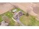 Stunning aerial view showcasing a house with a pool and manicured lawn, surrounded by a spacious yard at 4223 W State Road 234, McCordsville, IN 46055