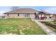 Spacious backyard featuring a covered patio with comfortable seating, ideal for relaxing or entertaining guests at 4223 W State Road 234, McCordsville, IN 46055