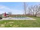 Backyard features a large in-ground pool, lounge chairs and well manicured green space at 4223 W State Road 234, McCordsville, IN 46055