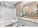 Bright bathroom features a shower-tub combo, granite countertop vanity, and modern fixtures at 4223 W State Road 234, McCordsville, IN 46055